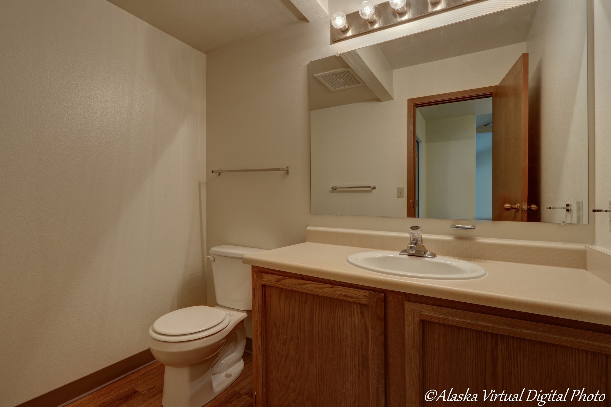 image of bathroom with sink and wood floors