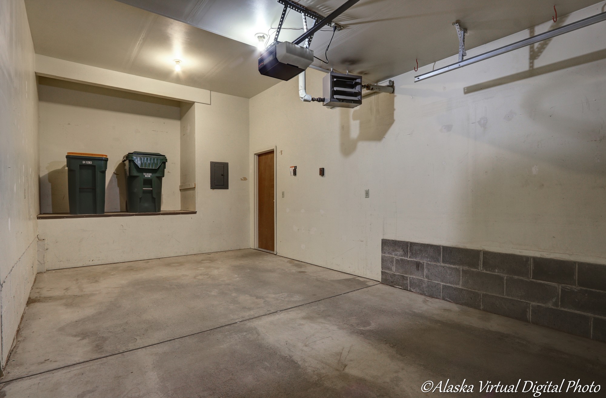 Image of garage with trash and recycling recepticles