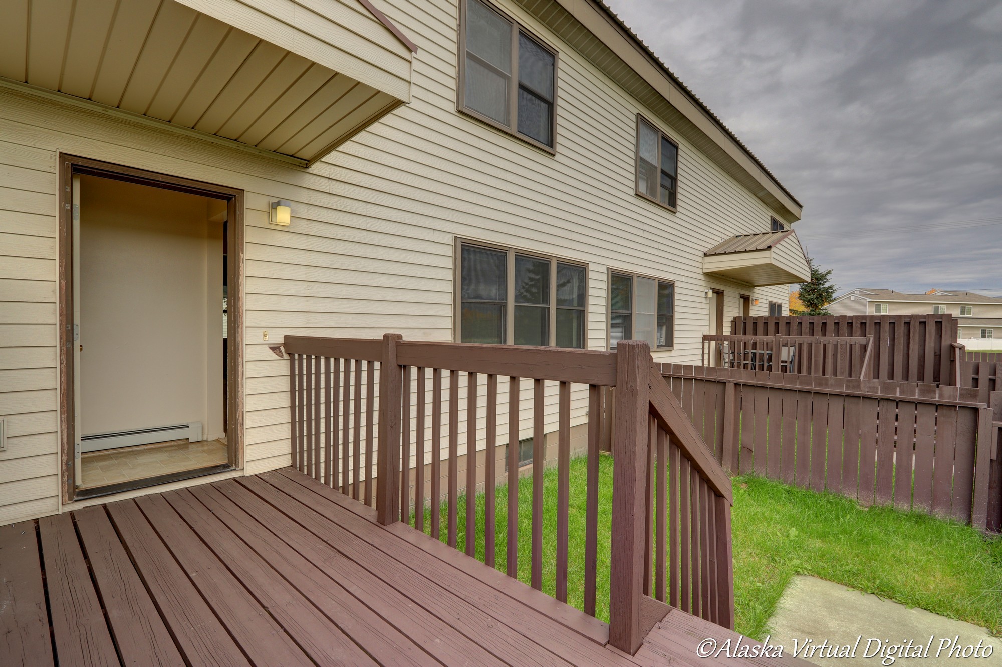 Photo of red deck leading into backyard