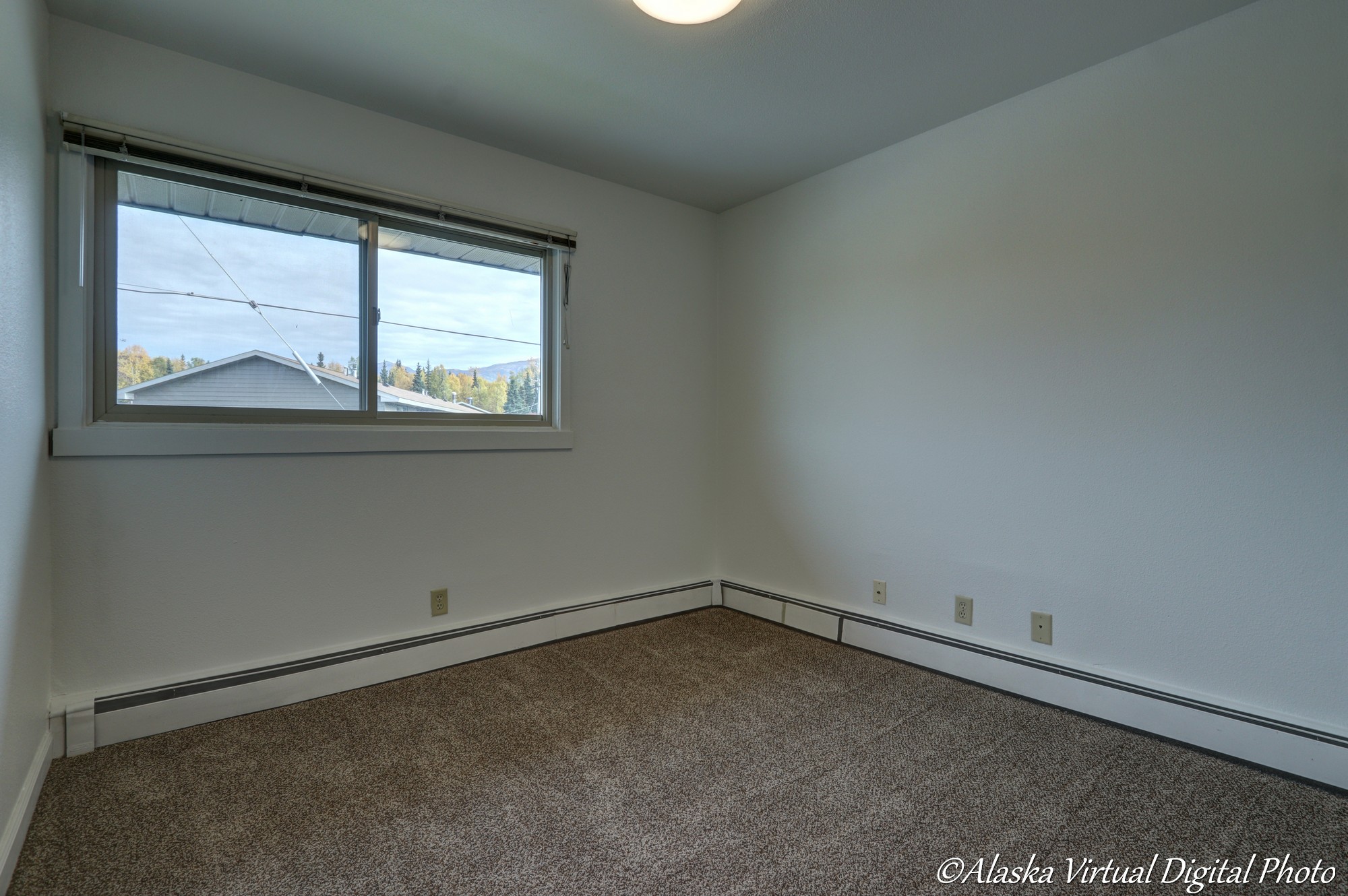 image of bedroom with window.