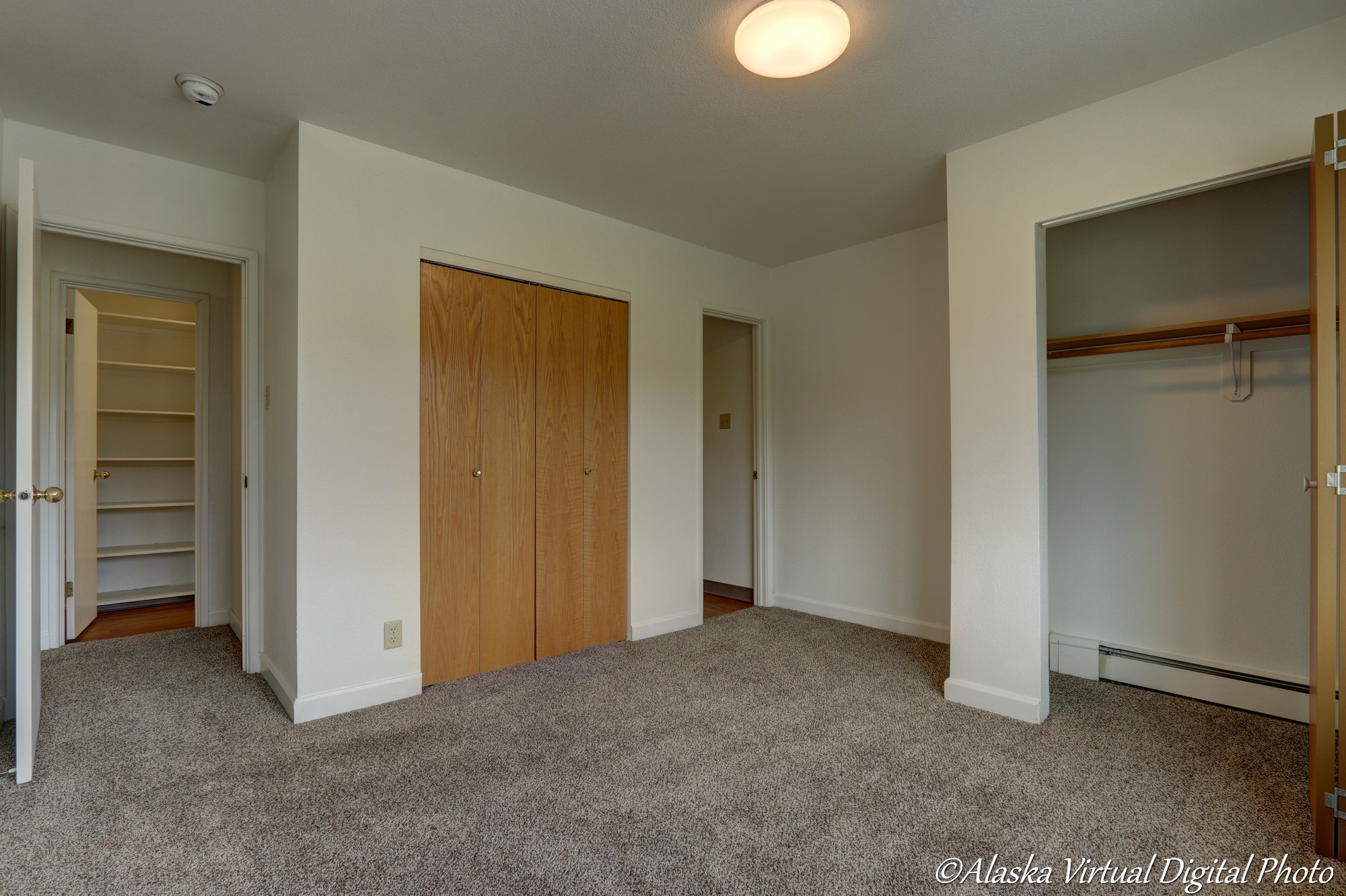 Image of bedroom with multiple closets and bathroom