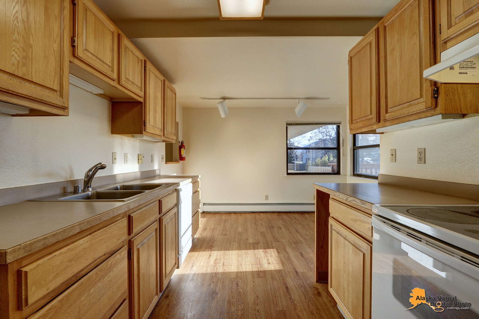 Kitchen with brown countertops and stove