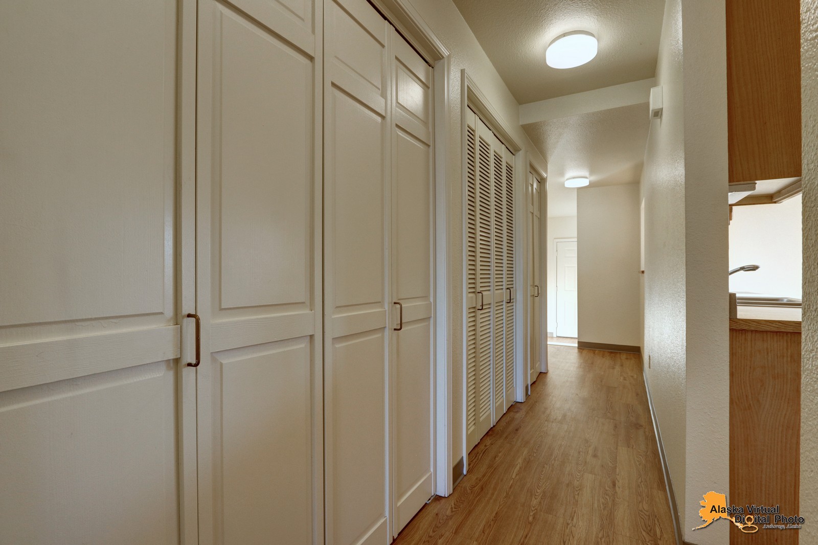 Hallway with multiple closets