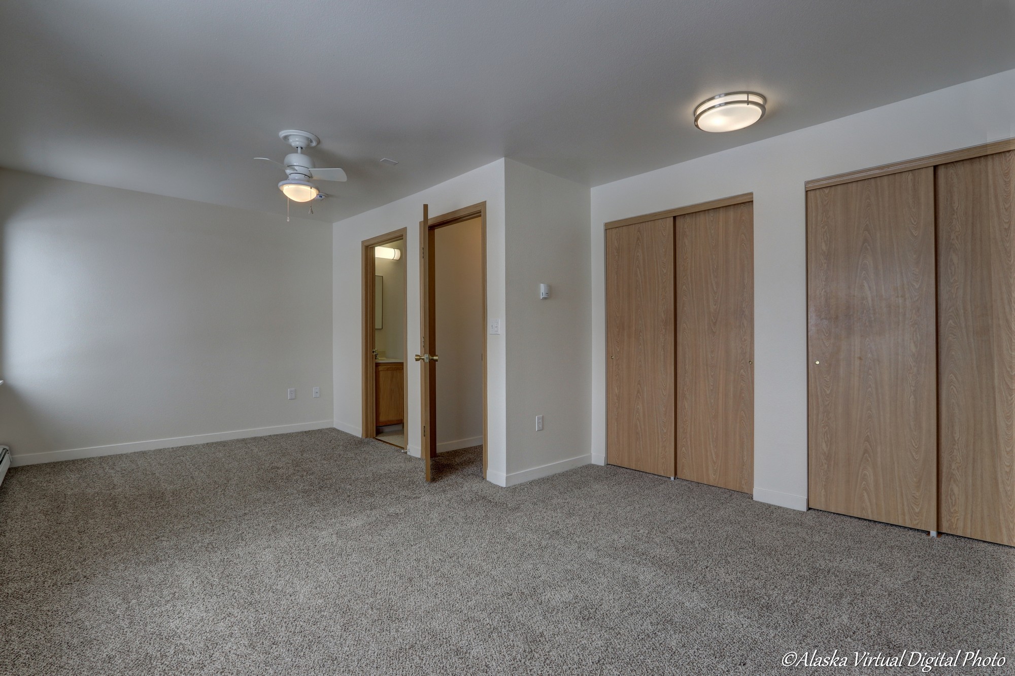 large master bedroom with three closets