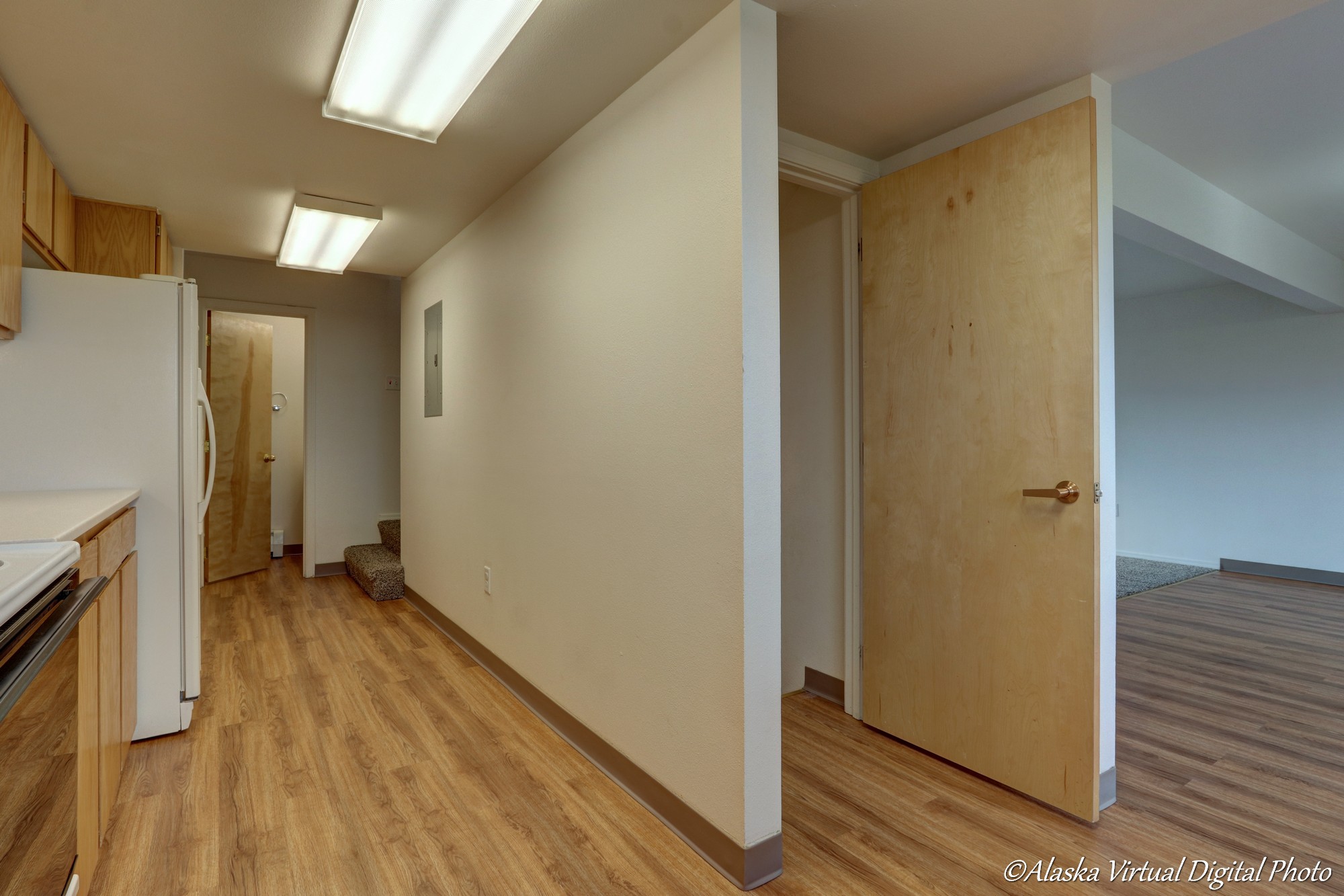 Kitchen with basement stairs on the right