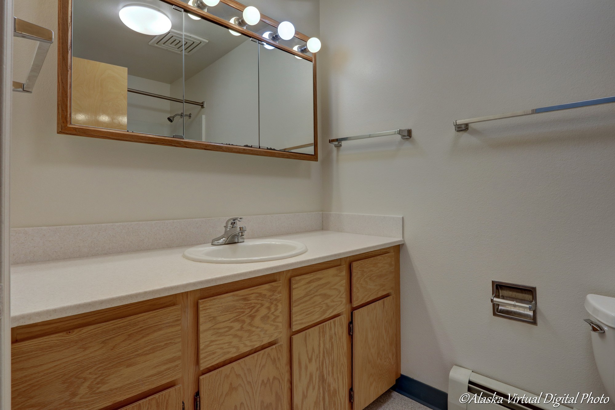 Bathroom with large counter and mirror