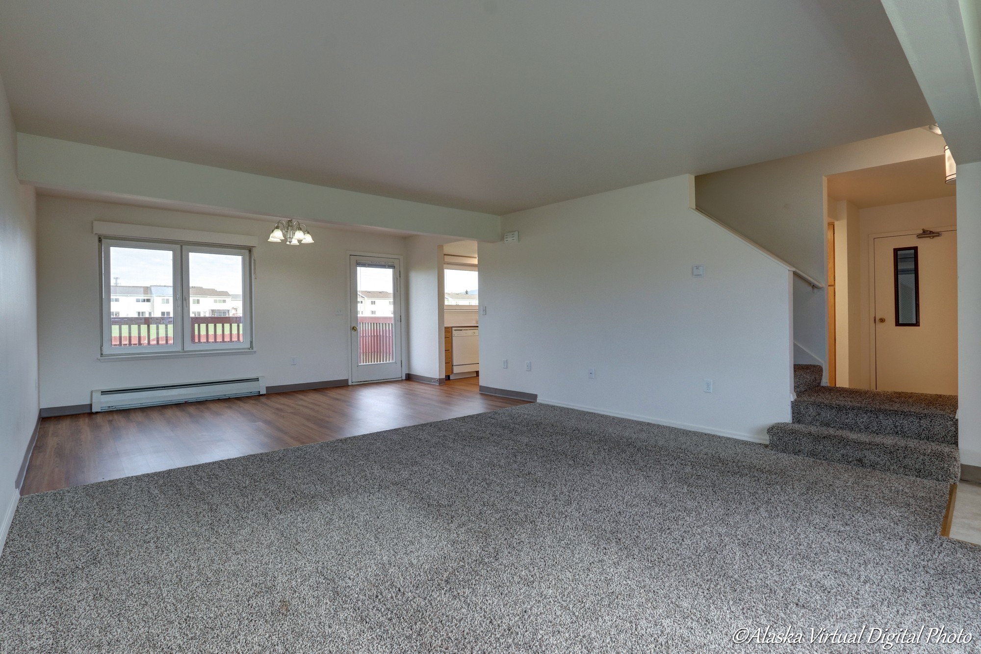 Living Room with stairs on the right and dinning area in back left