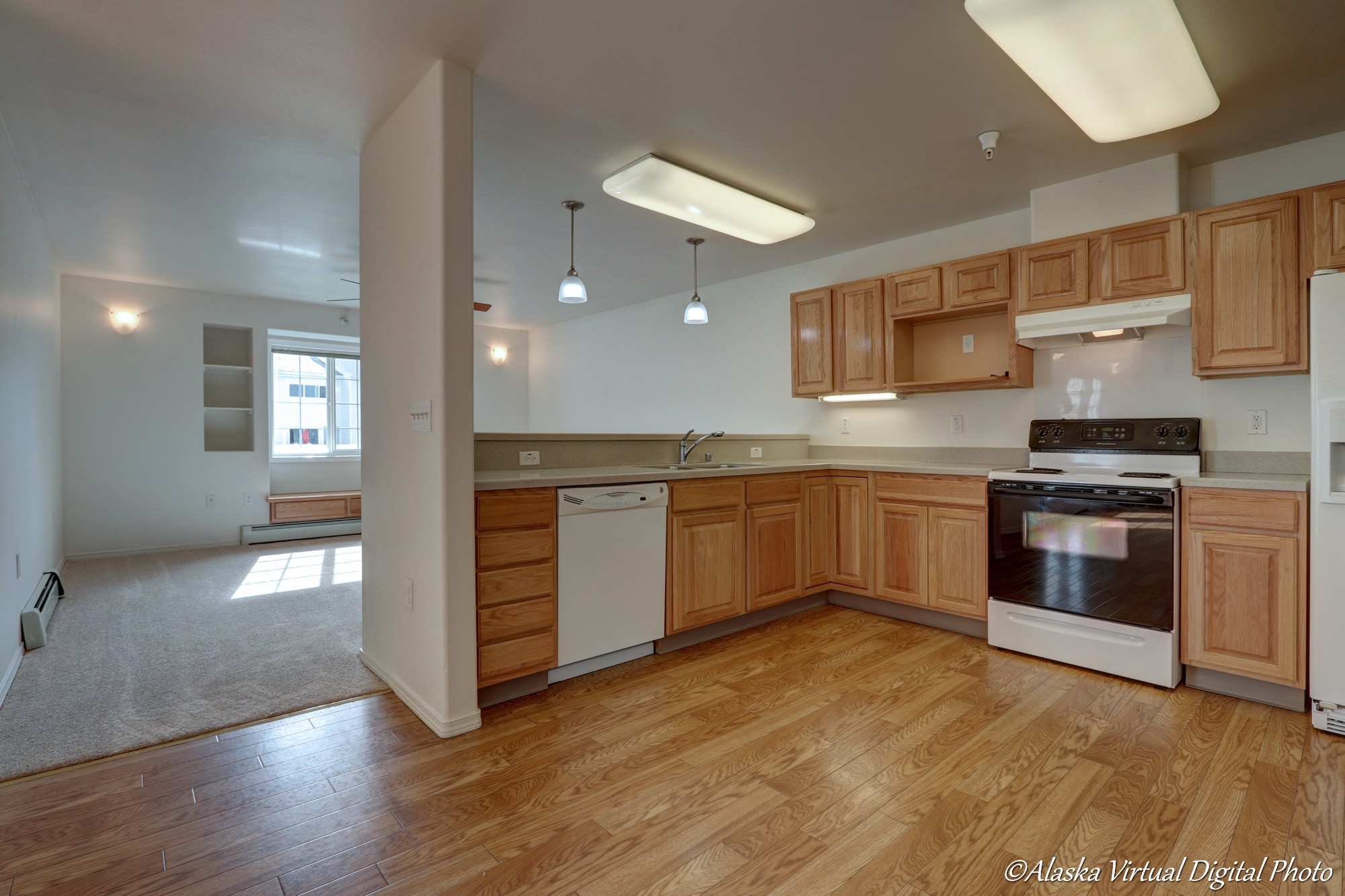 Open concept kitchen with view into living area