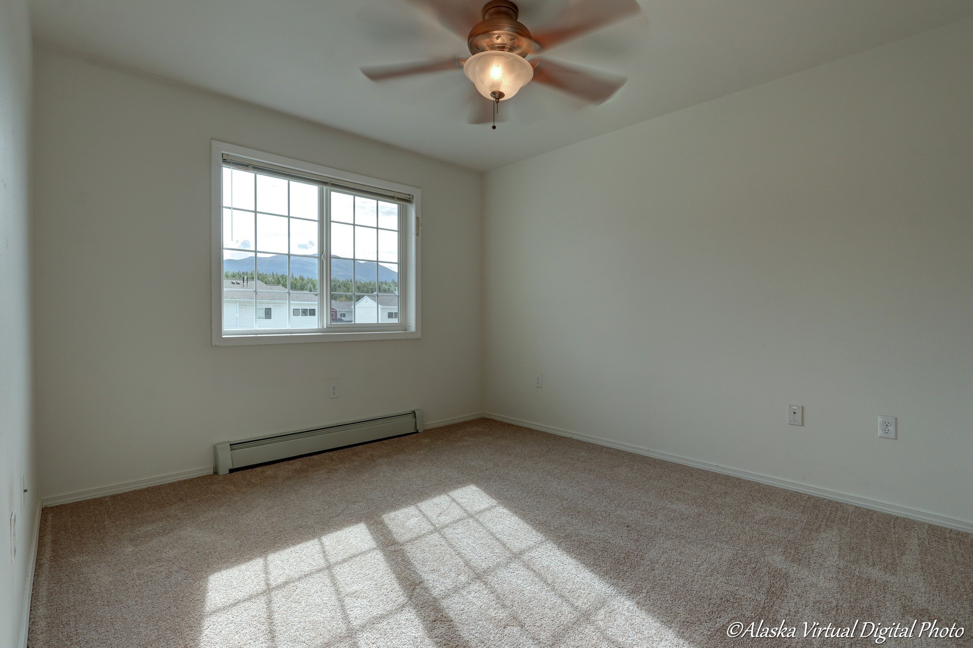 Image of bedroom window and fan