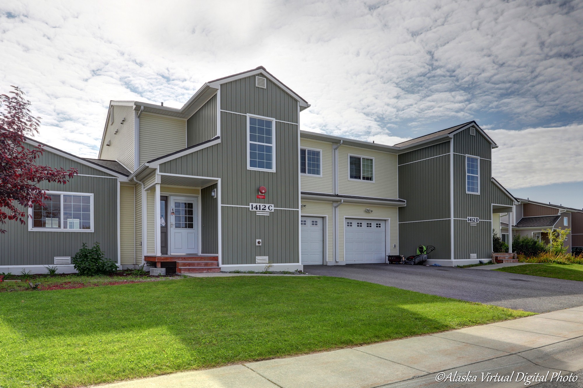 Exterior of home with tan and light green accents