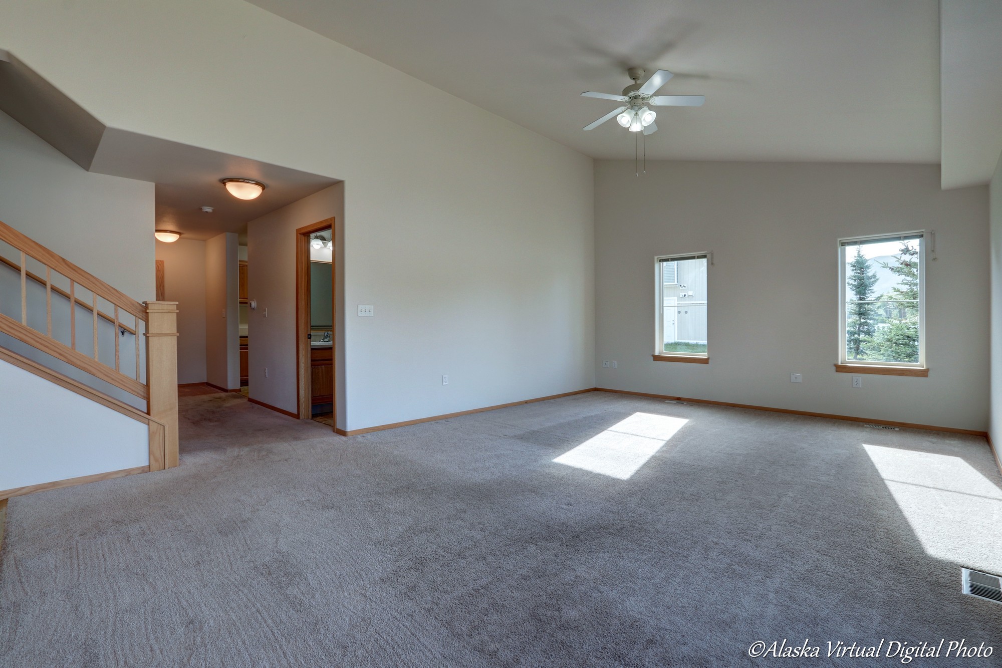 View from living room with powder room and laundry area to the left