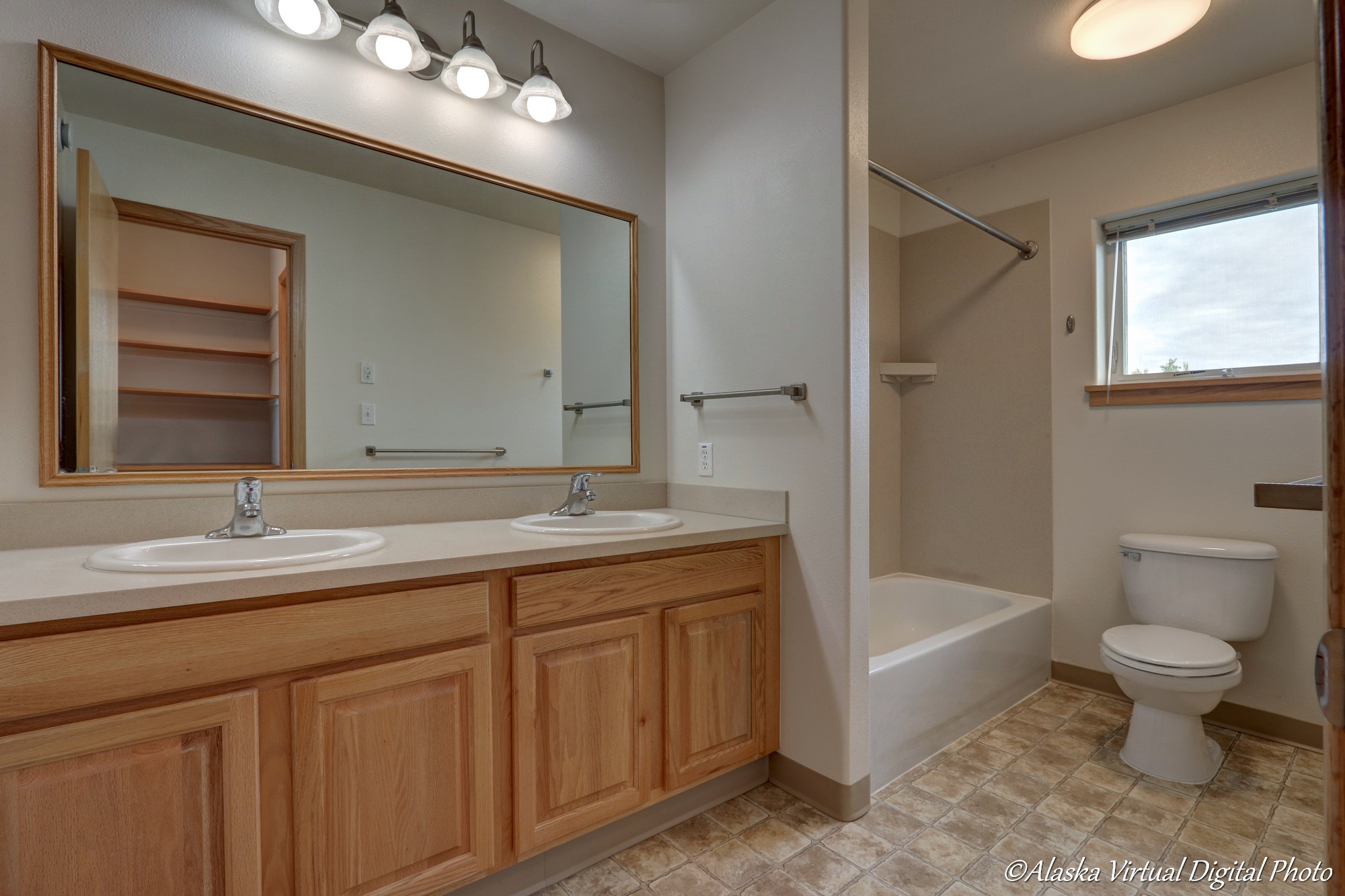 Master bath with double sinks and tub/shower