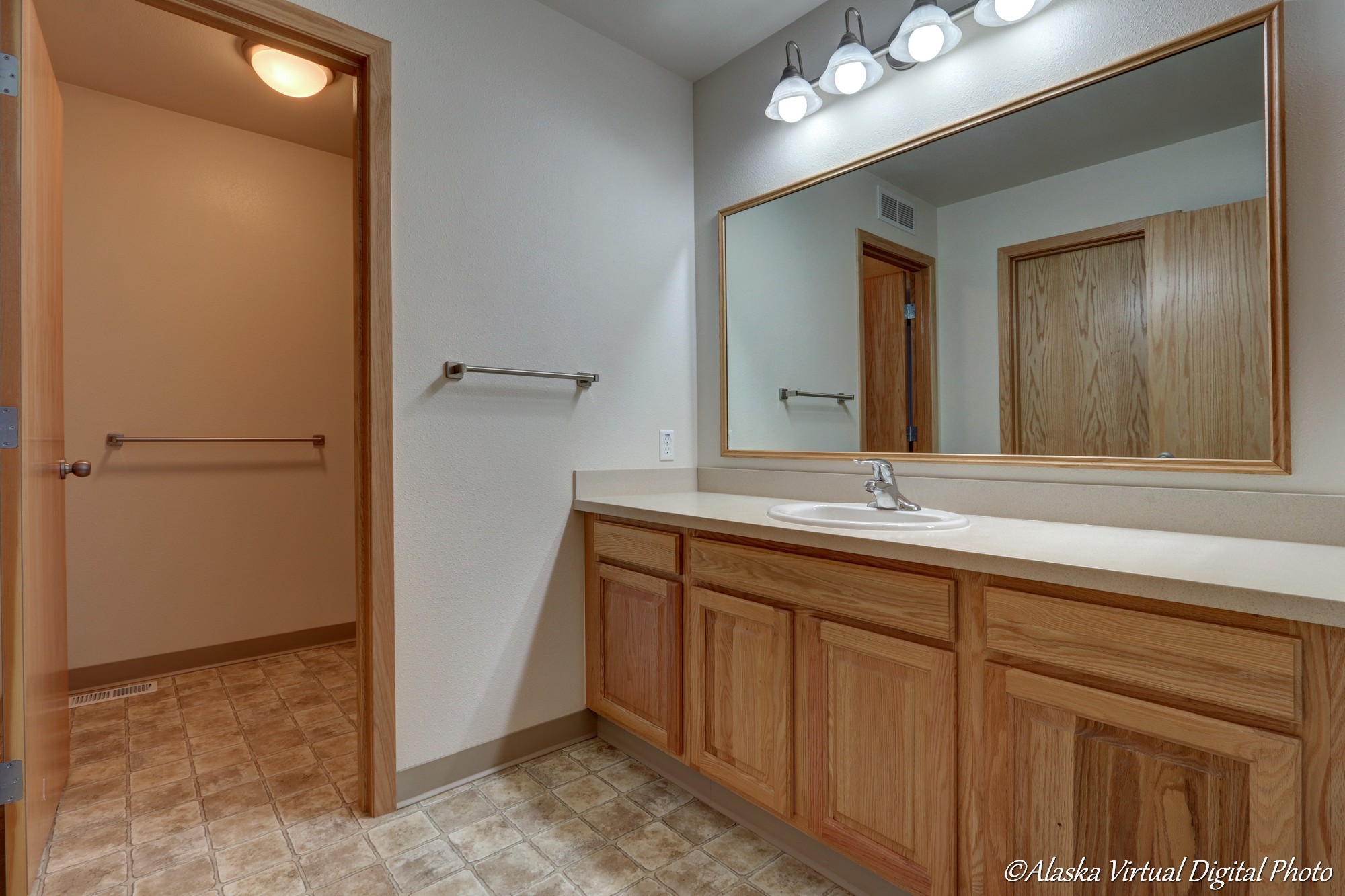 Bathroom with large vanity and sink