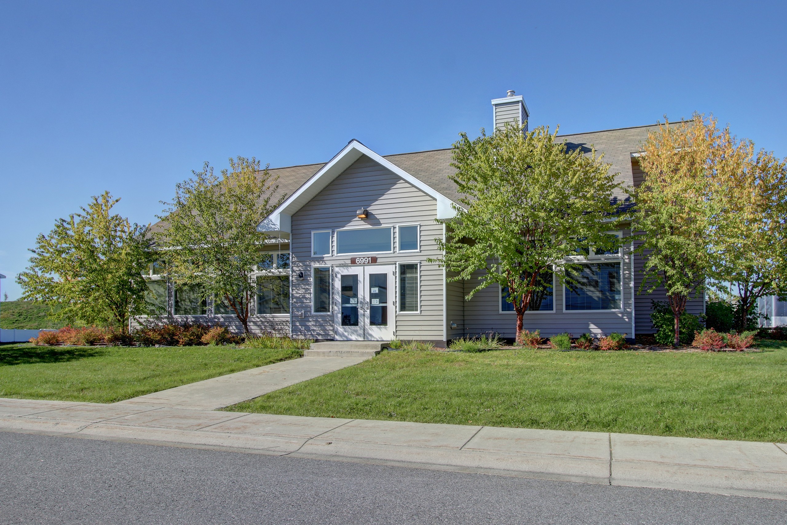 The exterior of the Moose Crossing Community Center in summer