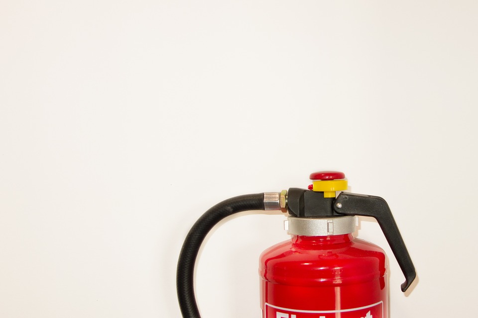 Top of a red home fire extinguisher.