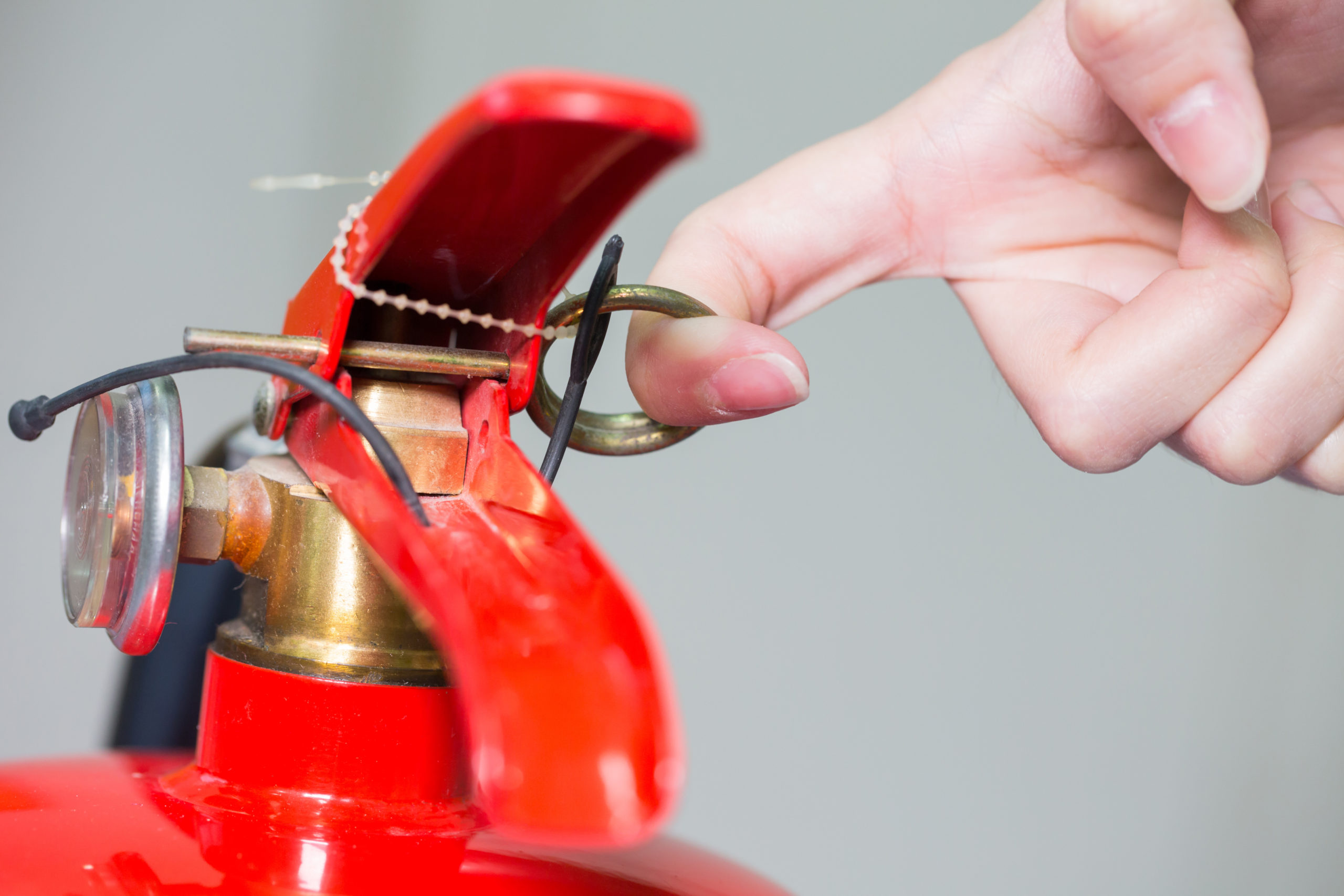 close up image of red fire extinguisher