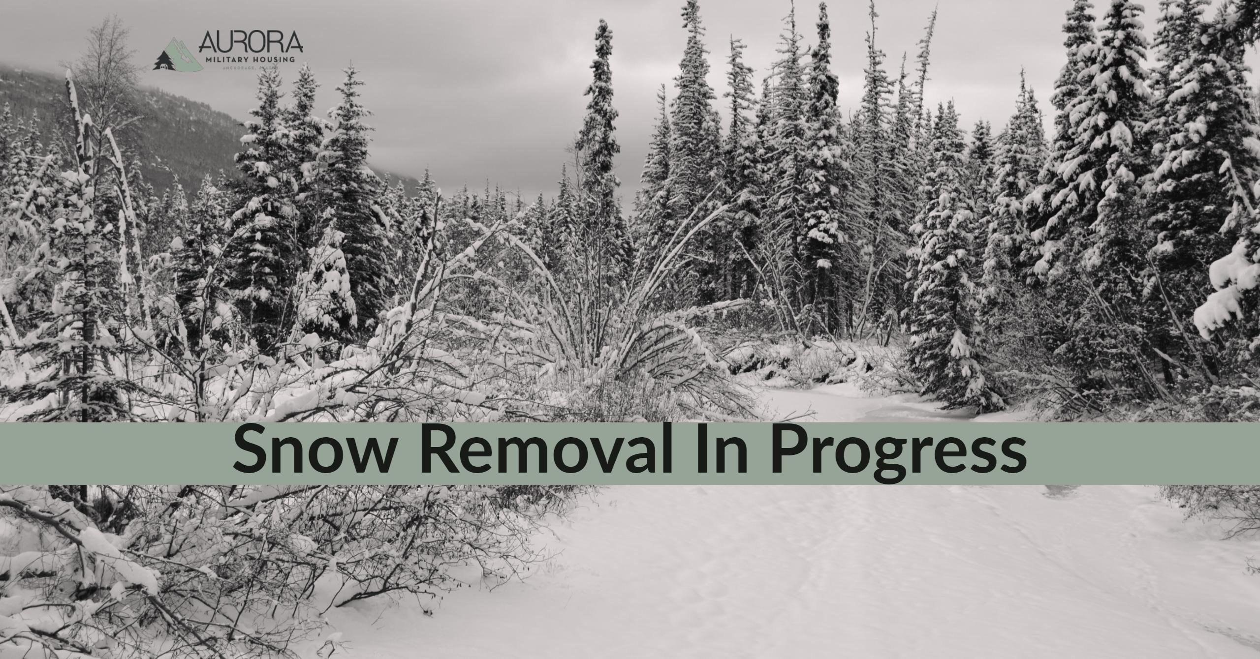 image of snowy landscape in alaska with text notating snow removal is in progress