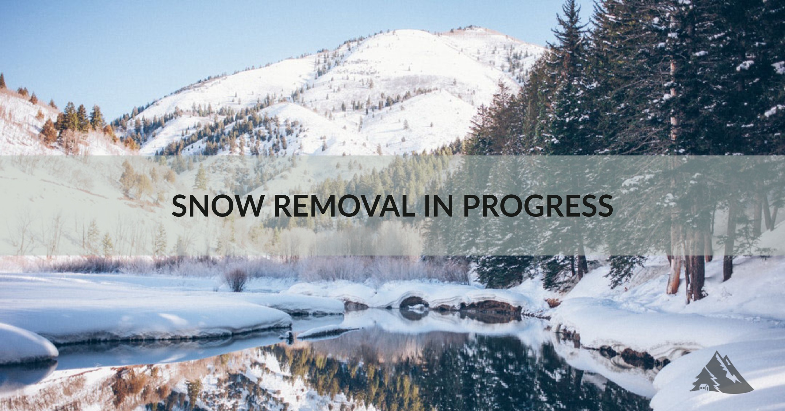 Image of mountains with text stating that snow removal is in progress