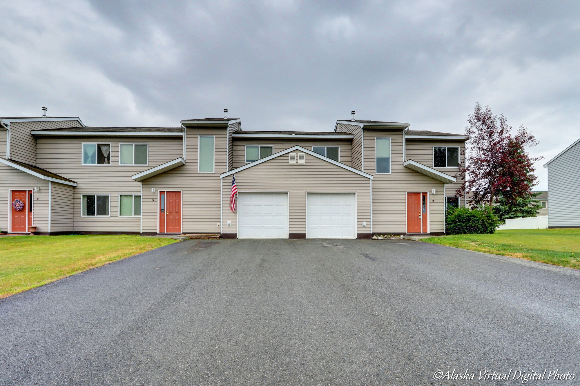 Photo of Exterior of home with red doors