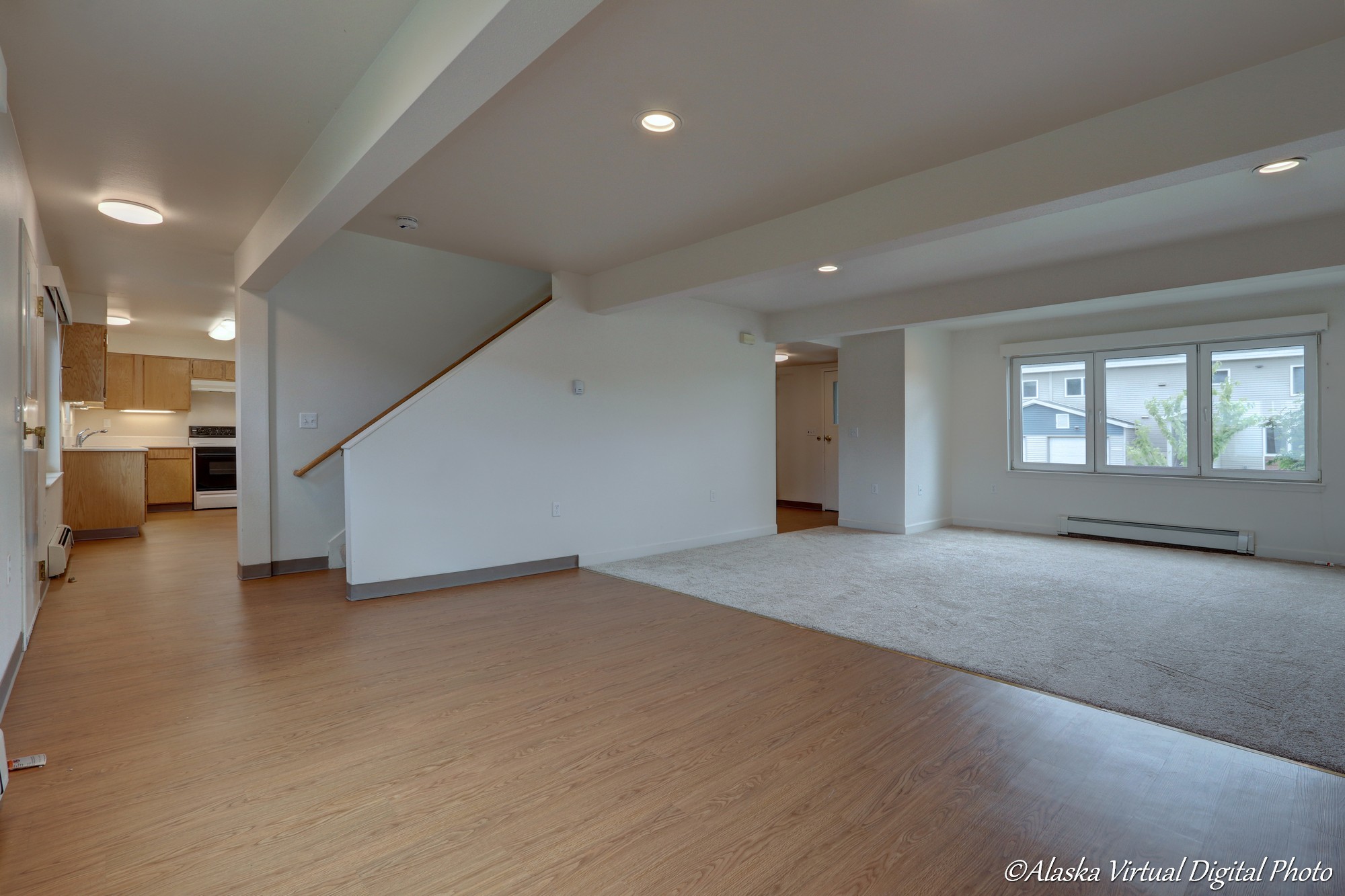 Taken from dining room with LVP, looking at living room on right and kitchen on left