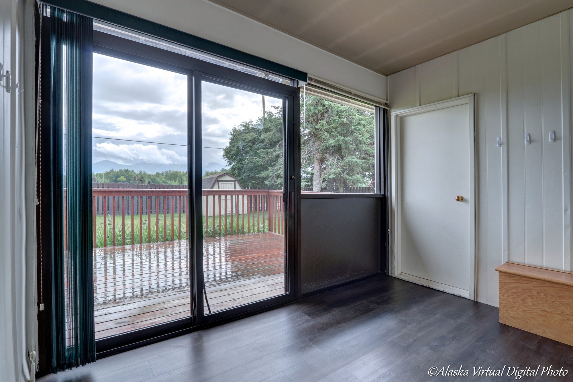 Photo from inside of mud room looking to back yard