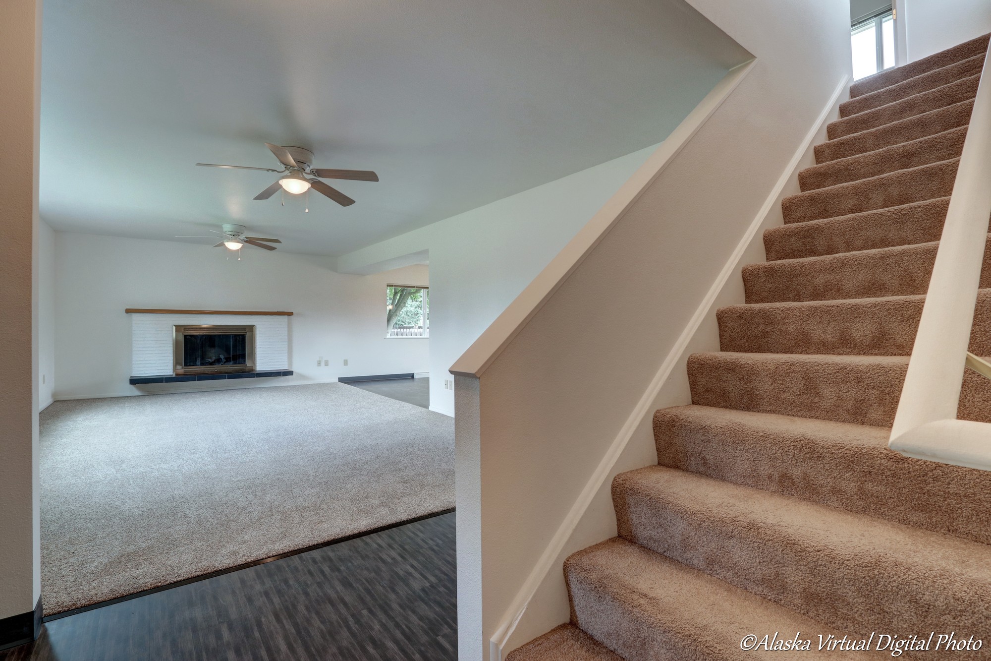 Stairway on right with living room and dining room on left