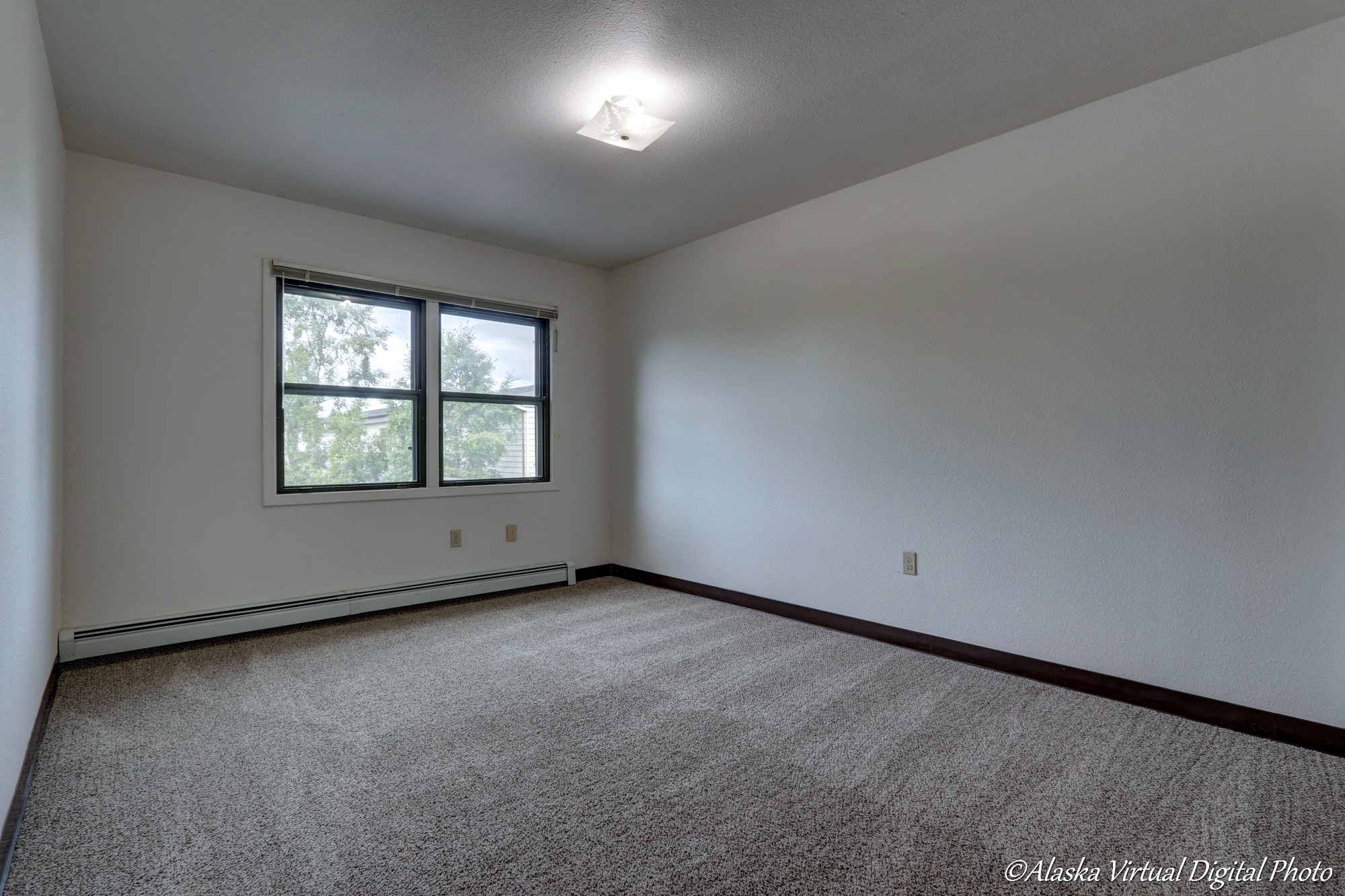 Photo of bedroom with large windows