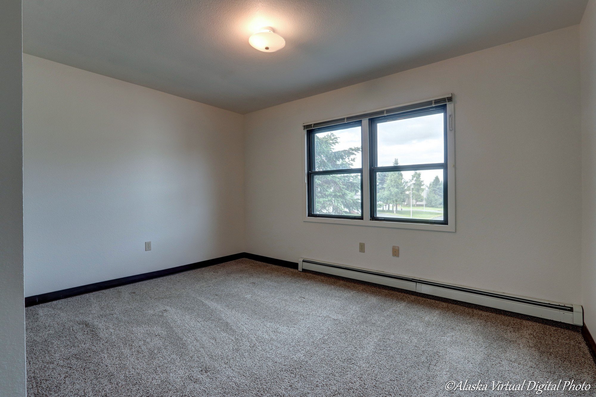 Photo of bedroom with large windows