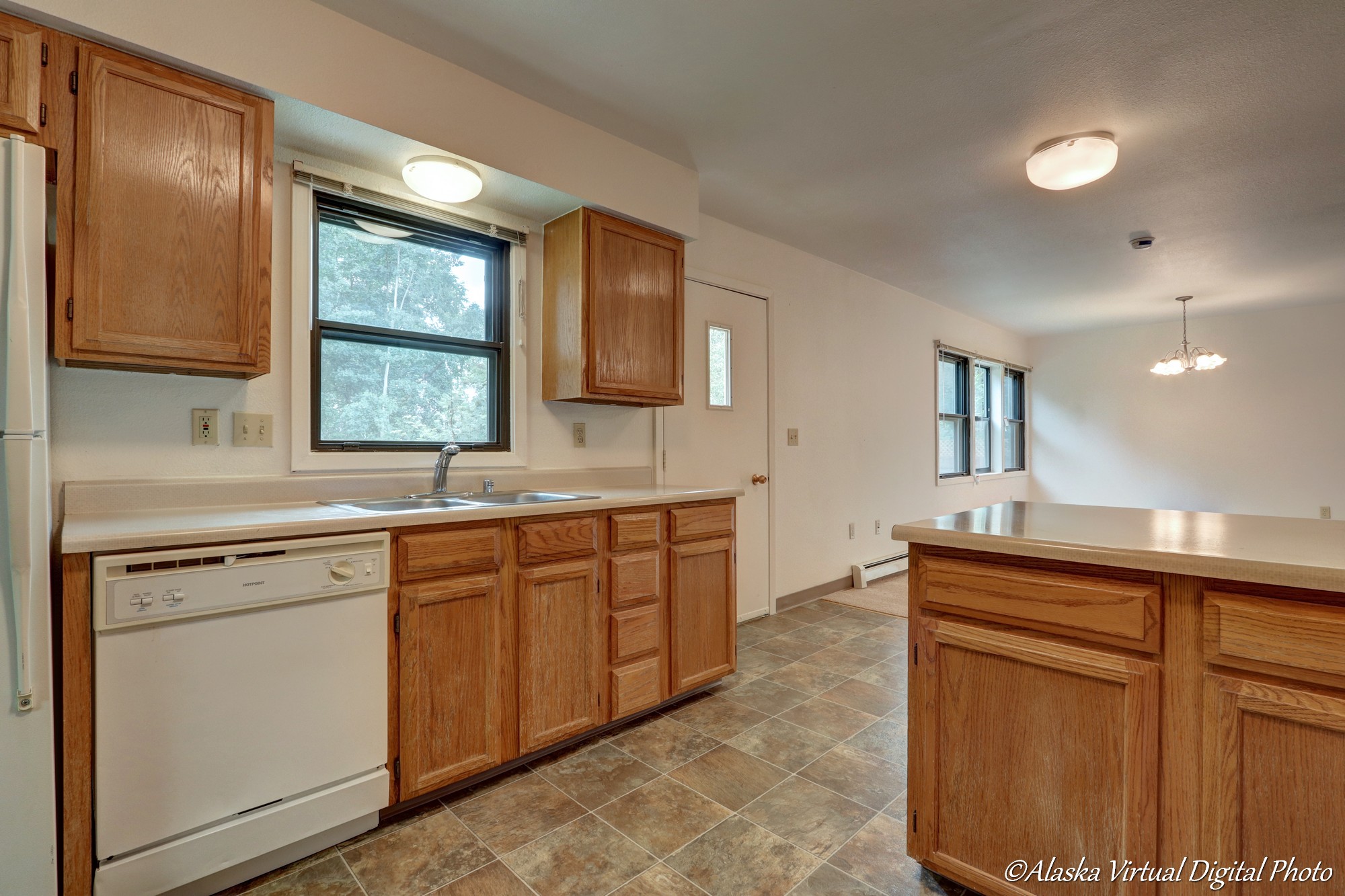 Photo of kitchen leading into dining area