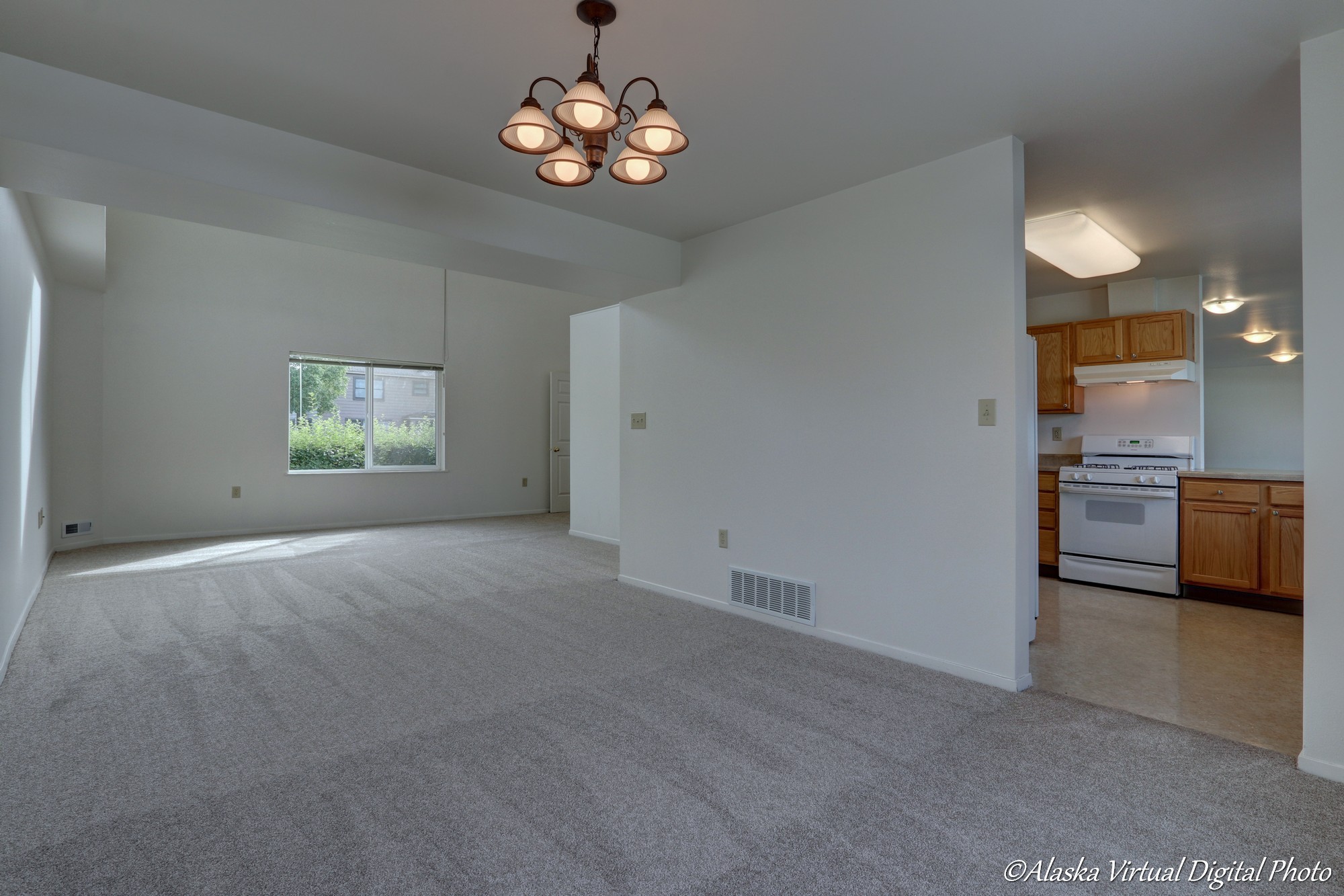 View from Dining Room with Chandelier into living room