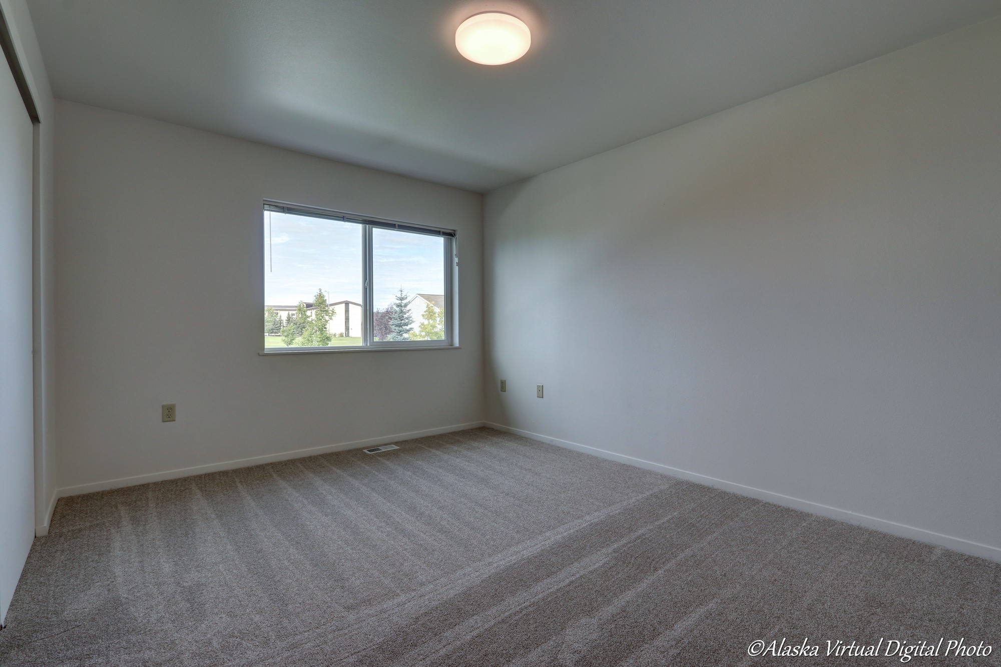 Image of bedroom with large rectangular window