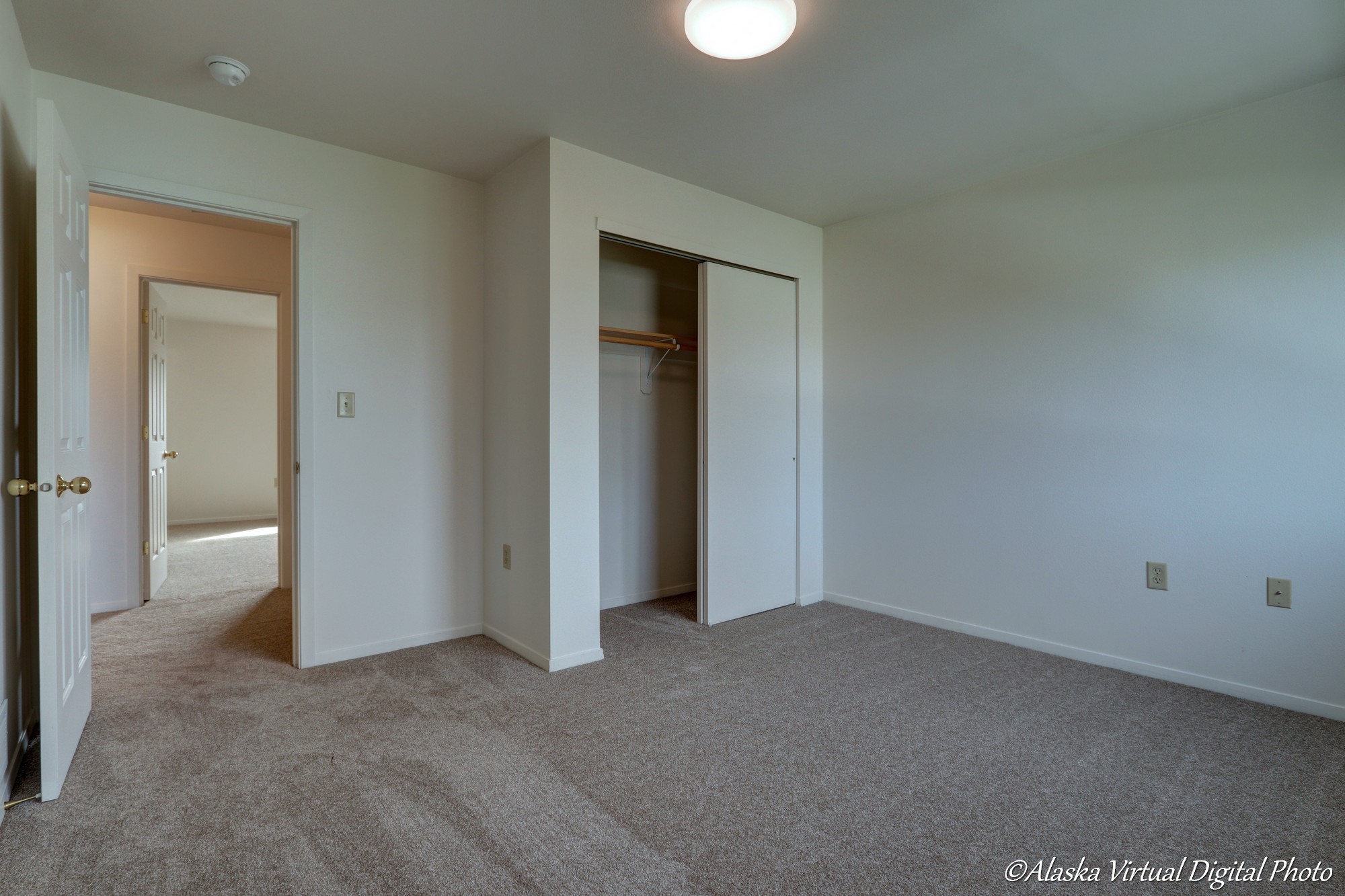 Image of bypass door closet in bedroom