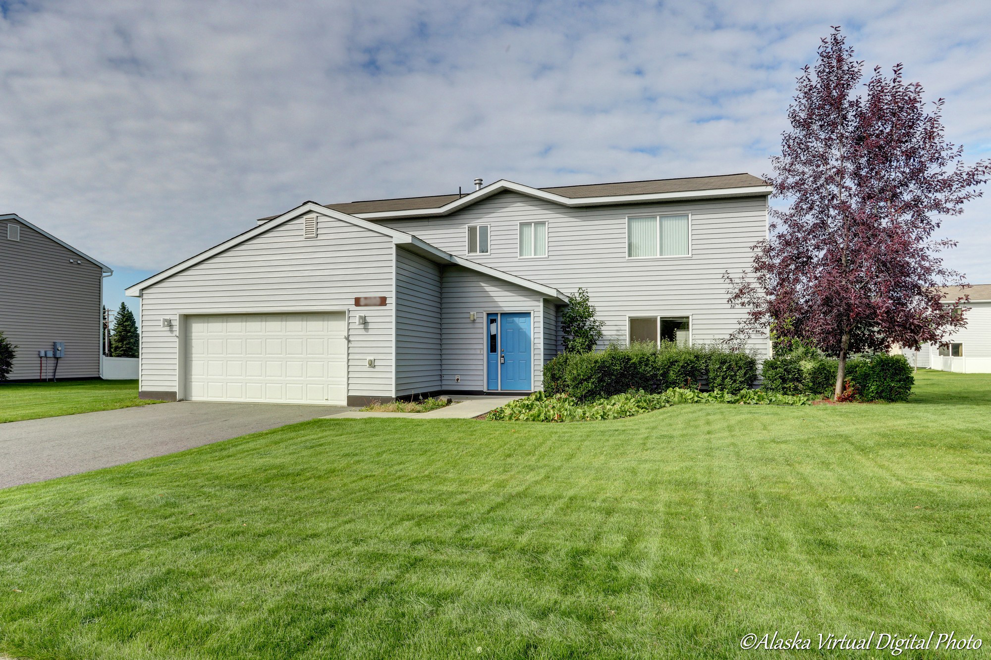 Exterior of home with green grass