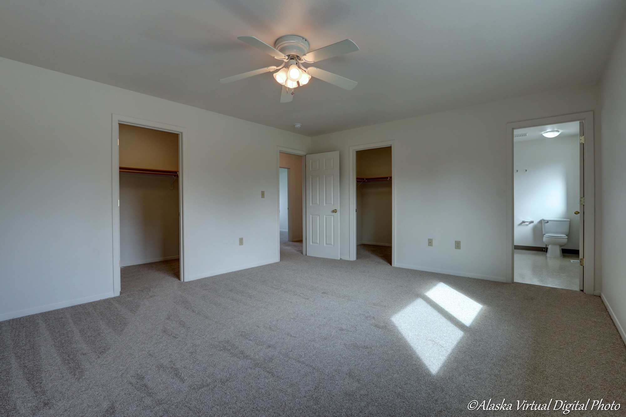 View of master bedroom closets and bathroom