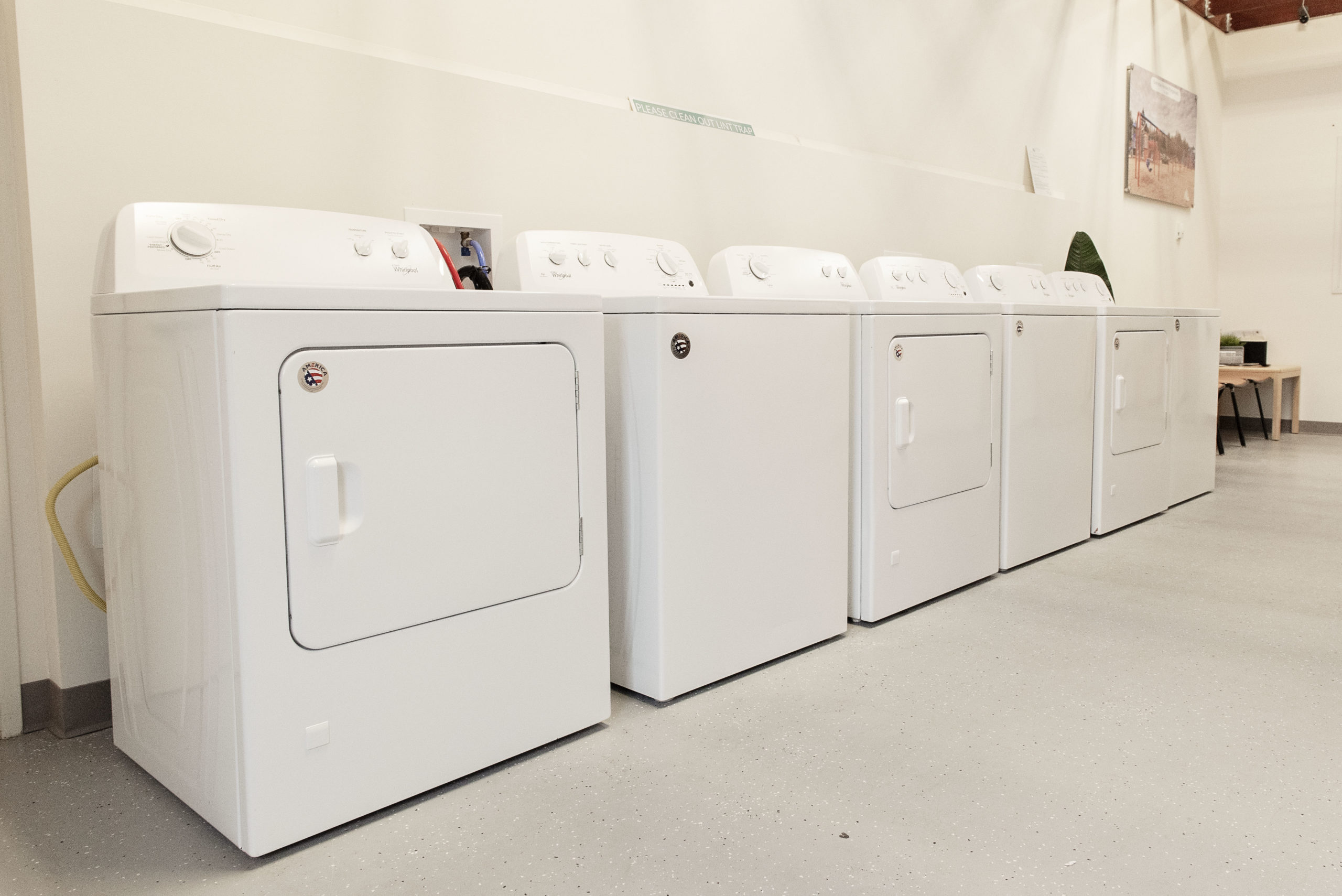 row of washers and dryers & seating area