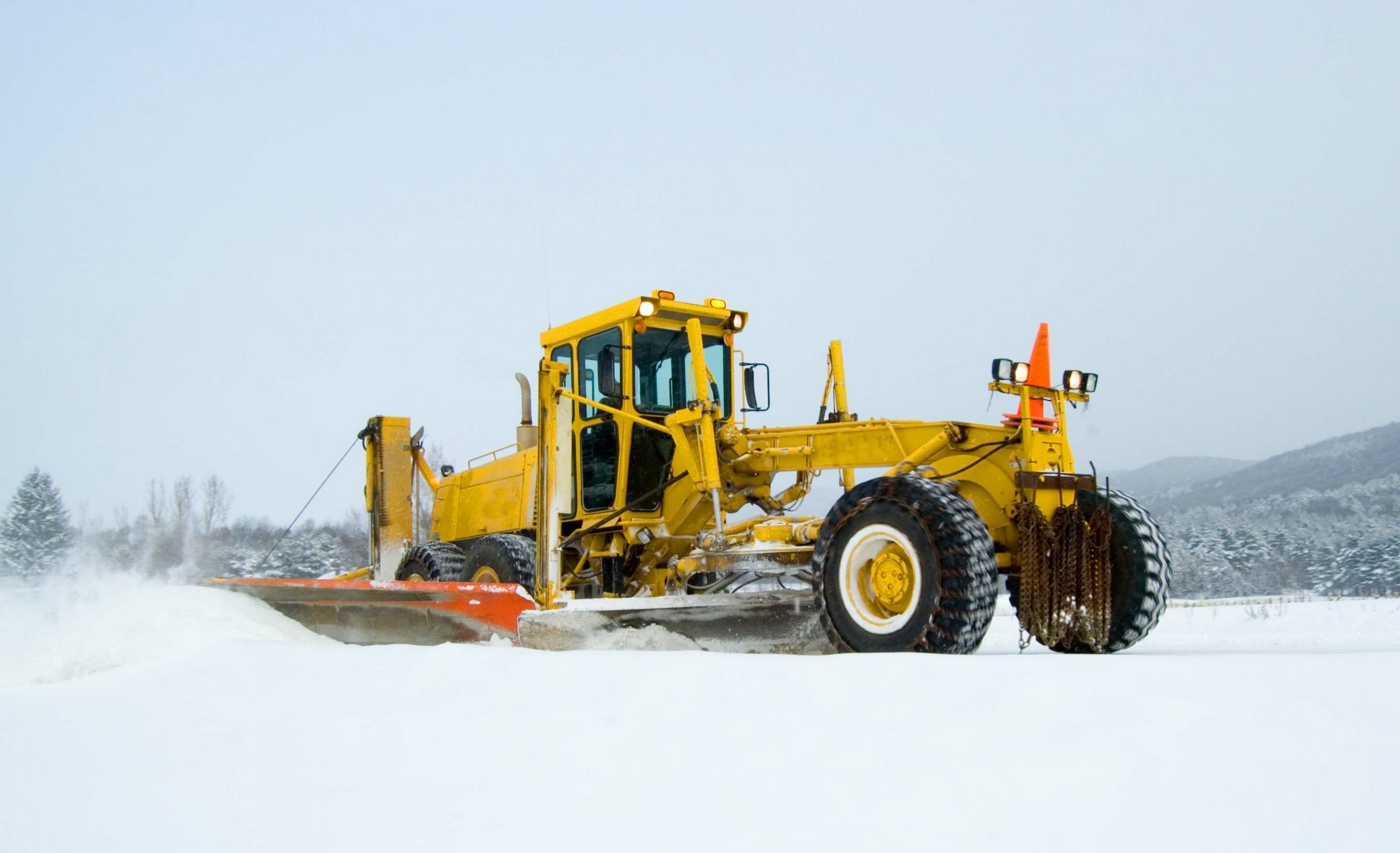 grader in snow