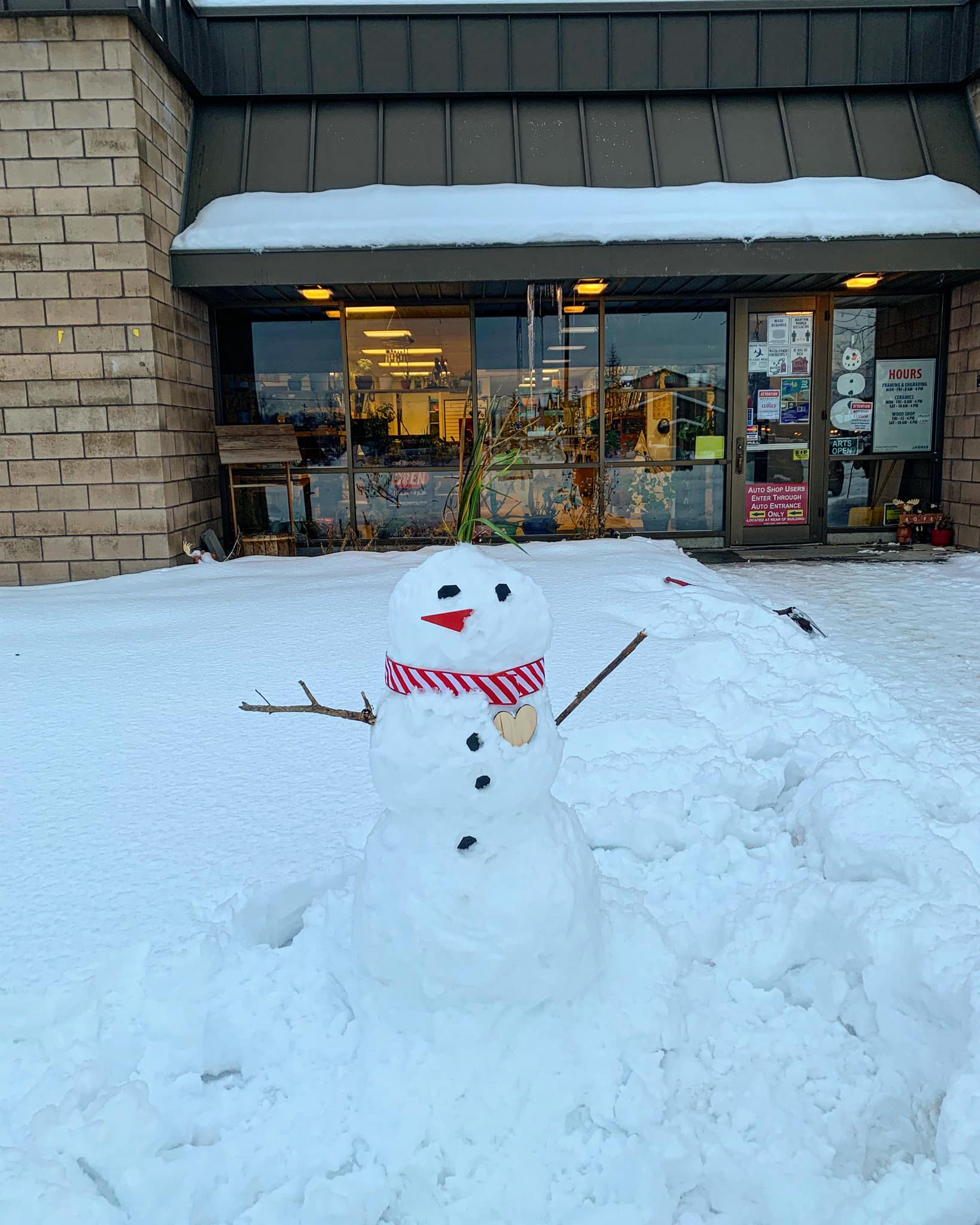 snowman in front of entrance to arts and crafts center