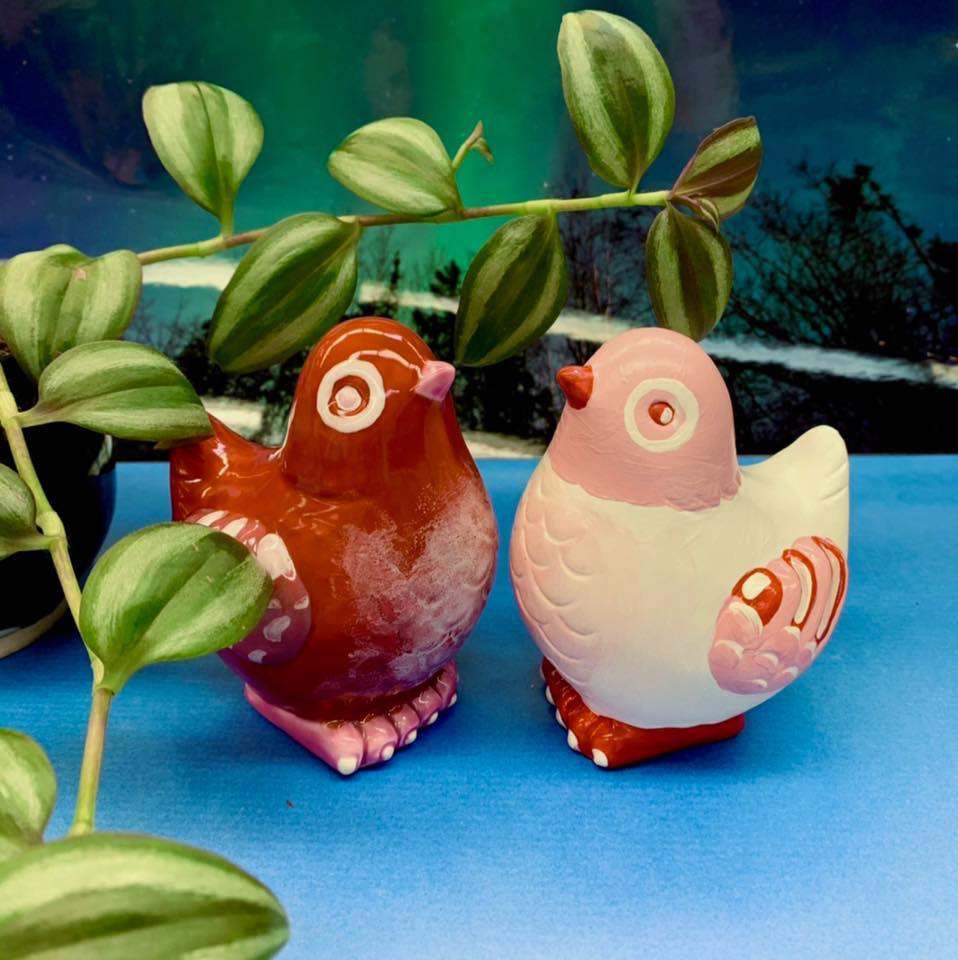 painted ceramic birds, red and pink hues