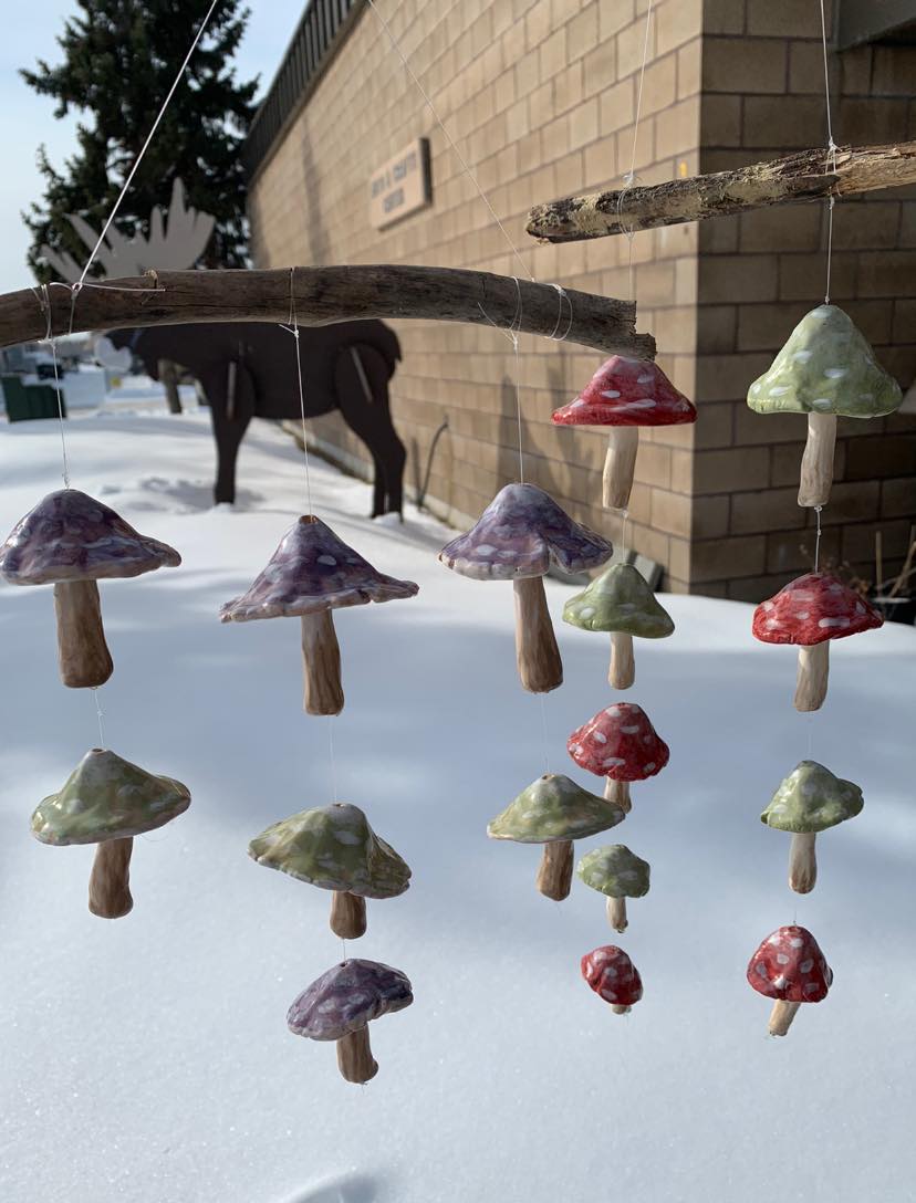 mushroom chimes in foreground with arts and crafts center in background