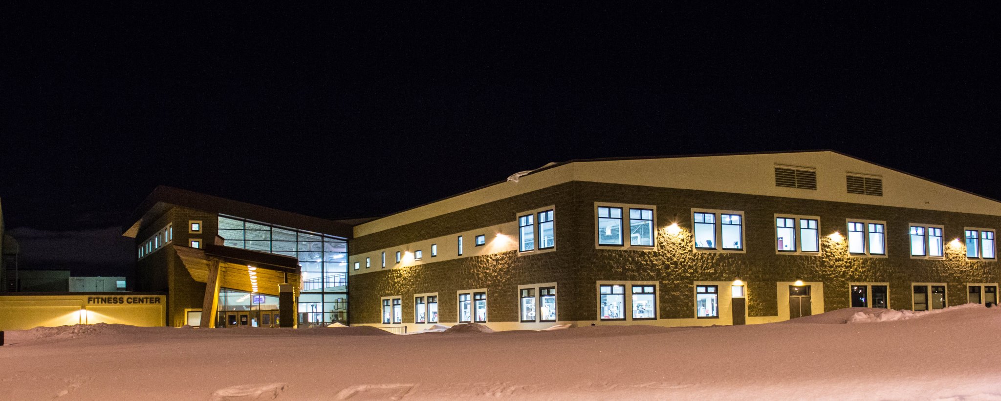 nighttime exterior photo of elmendorf fitness center