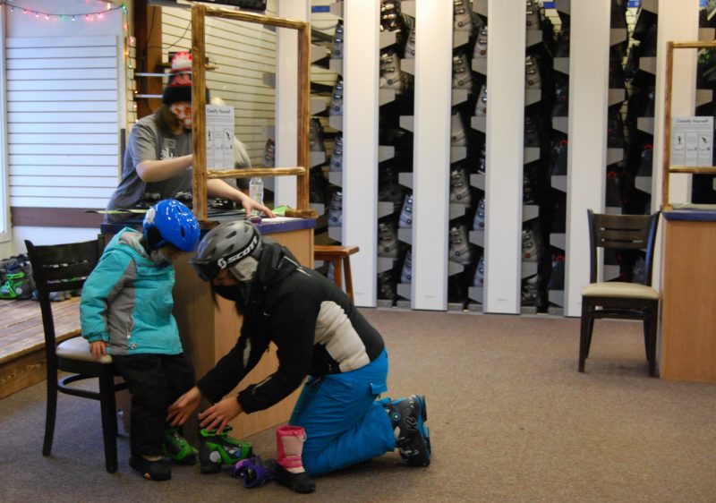 parent helping kid get ready at hillberg lodge